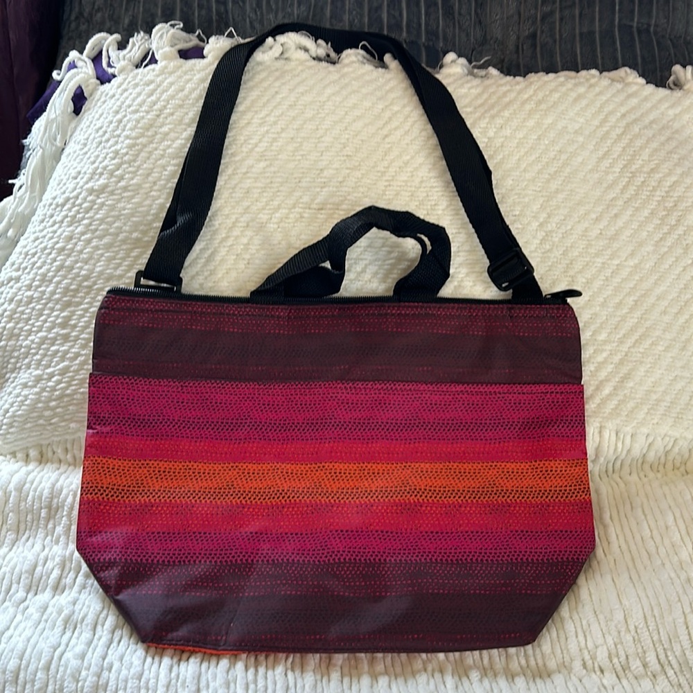 Thirty-One insulated bag with handles and a strap.